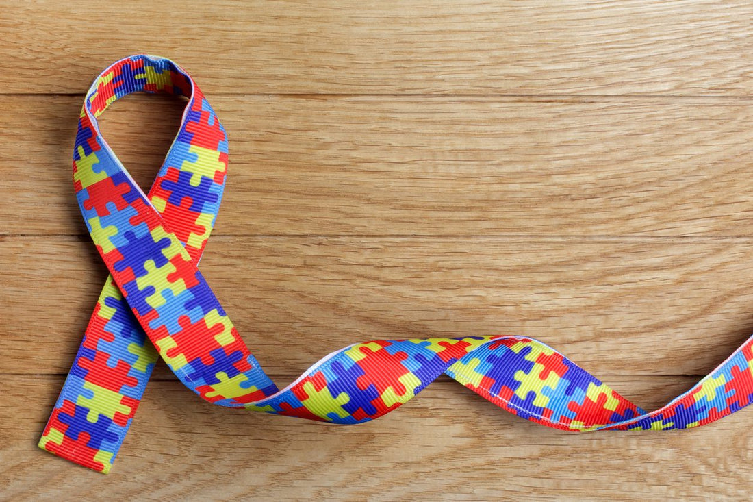 puzzle piece ribbon logo