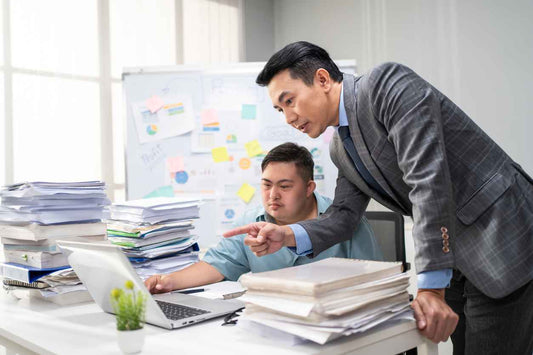 Male employee with autism or special needs brainstorm, plan and discuss project with manager.